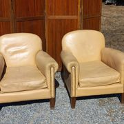 Pair of 1930s club armchairs in ivory leather.
