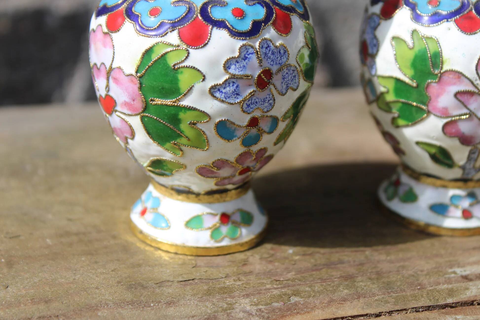 Two small vintage cloisonné enamel vases with Asian floral decoration.