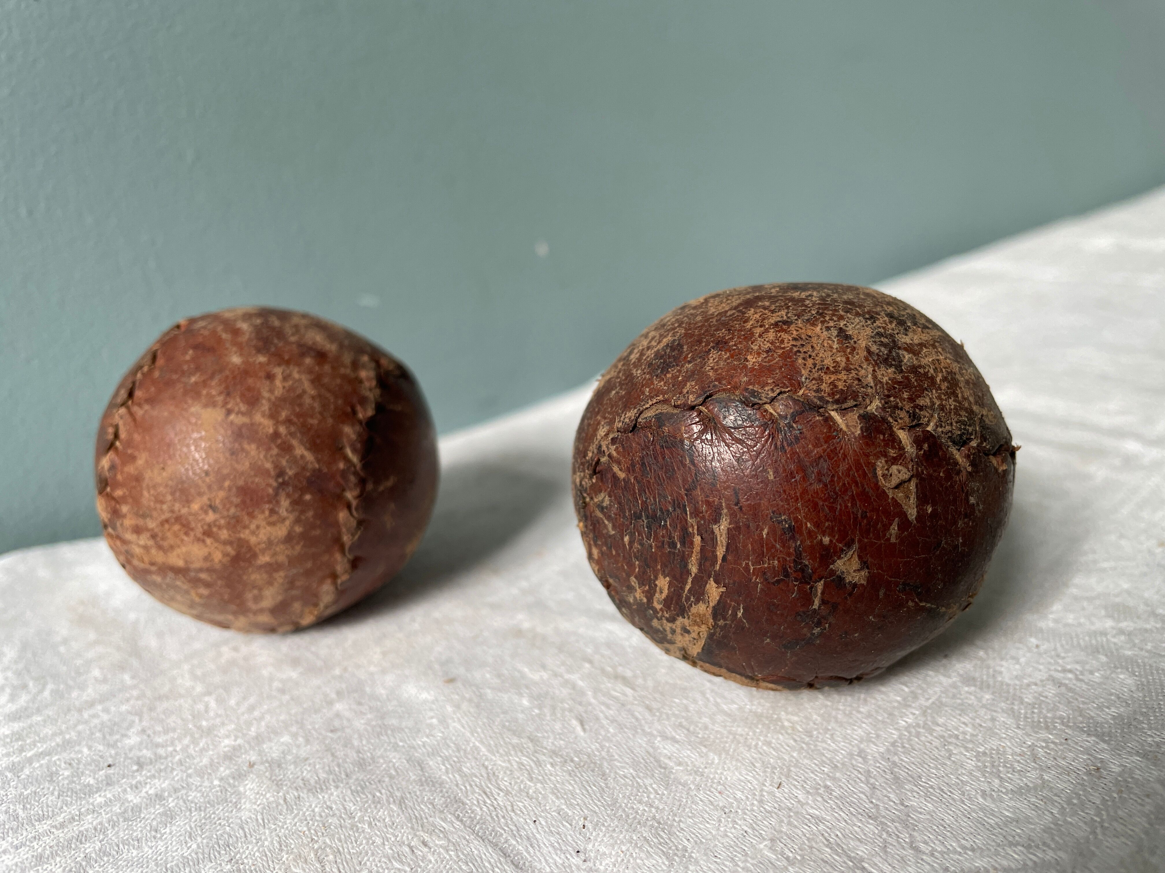 Two old nineteenth century leather golf balls