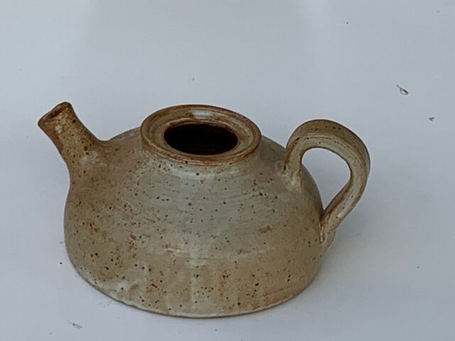Vintage teapot in reeds