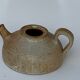 Vintage teapot in reeds