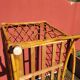 Bamboo and rattan baby cot with canopy.