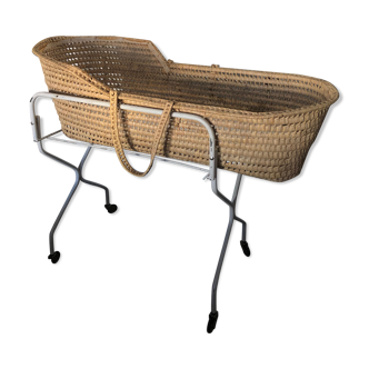 Wicker cradle braided on vintage wheeled metal stand