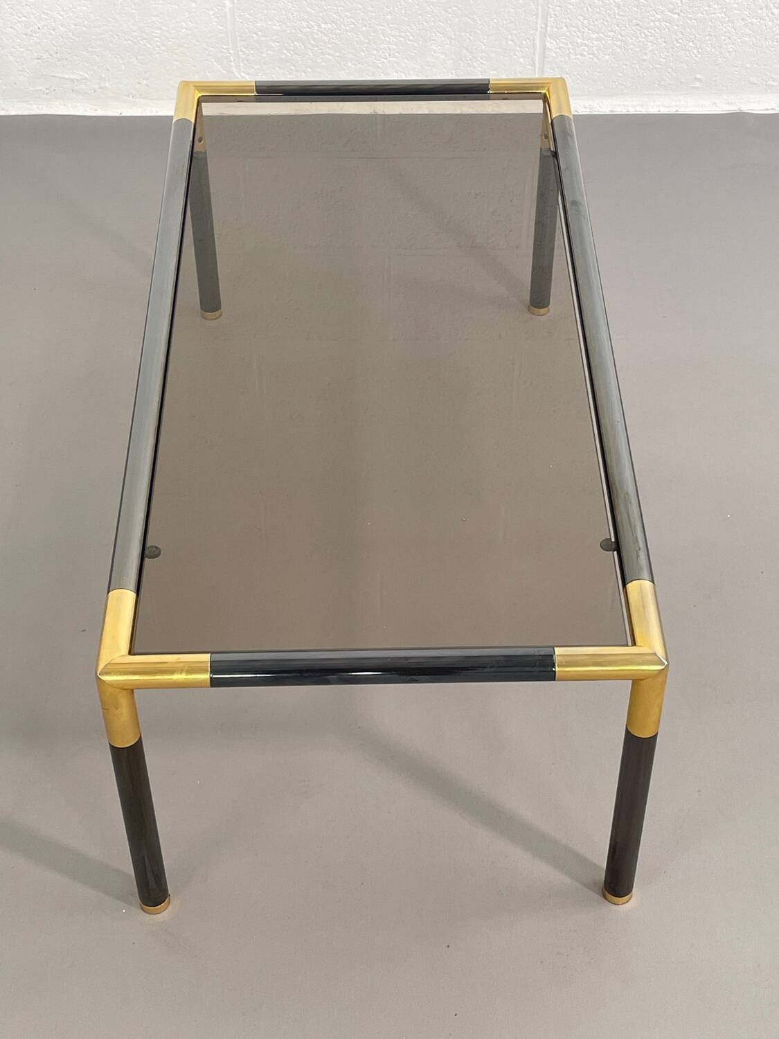 Gunmetal gold metal and smoked glass coffee table from the 70s