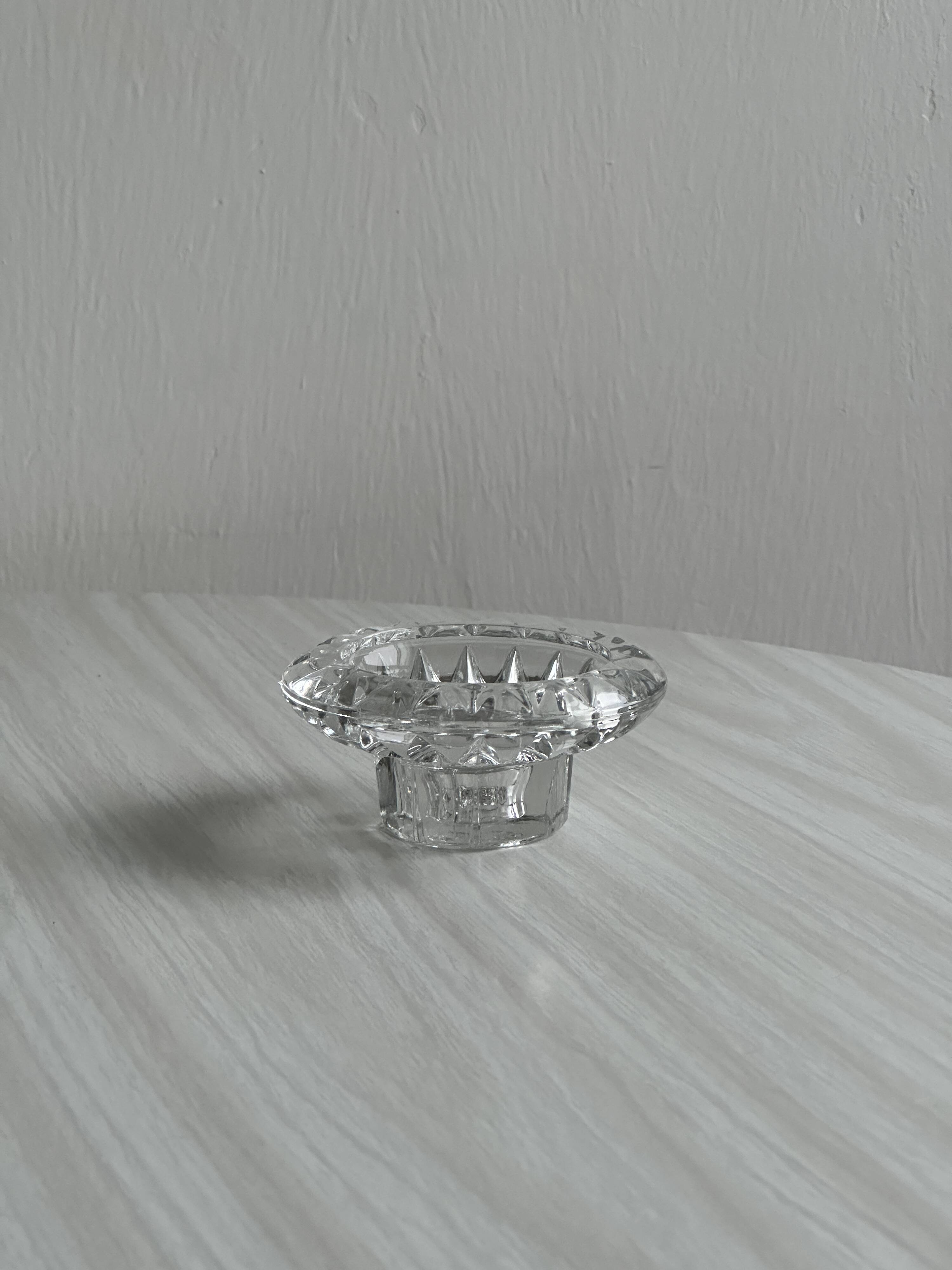 Duo of small candlesticks in chiseled glass