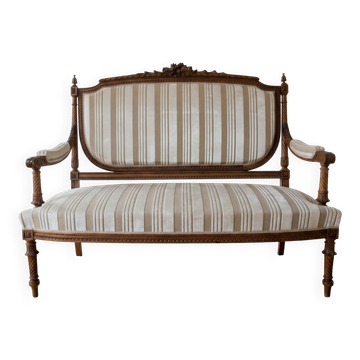 Louis XV style classic canapé reupholstered in striped beige fabric.