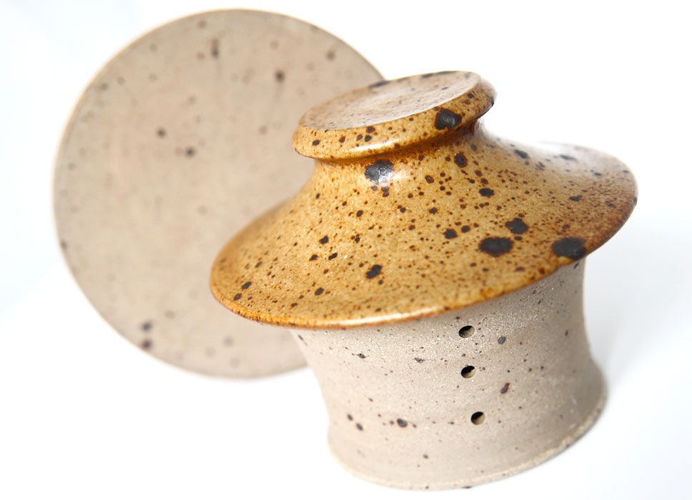 Handmade and rustic water butter in pyrity sandstone