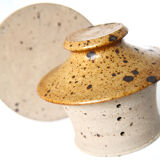 Handmade and rustic water butter in pyrity sandstone