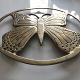 Brass trivet depicting a butterfly