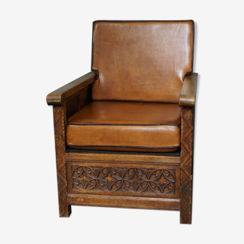 Antique armchair in sheep leather, carved wood