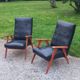 Pair of vintage beech armchairs feet compass covered with black moleskine from the 50s