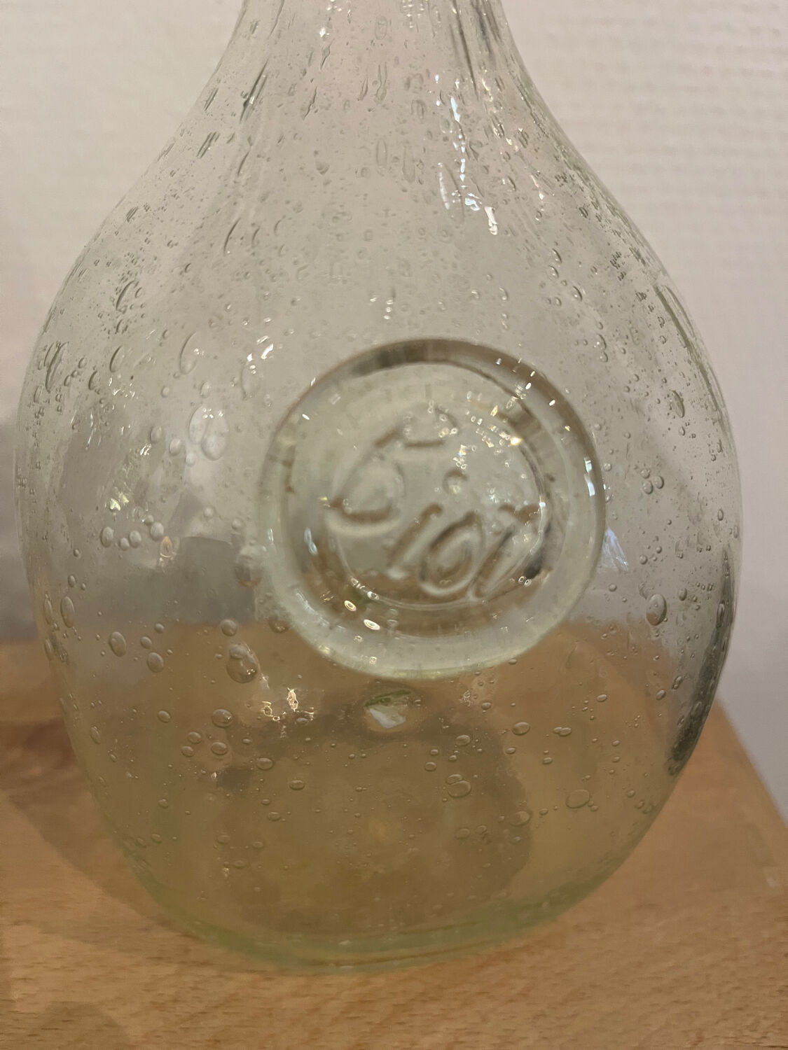 Signed Biot bubble glass bottle