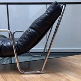 Pair of vintage armchairs in black imitation leather and chrome metal, France 1970