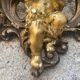 Pediment cherub musician