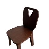 Retro brutalist chair in dark solid wood