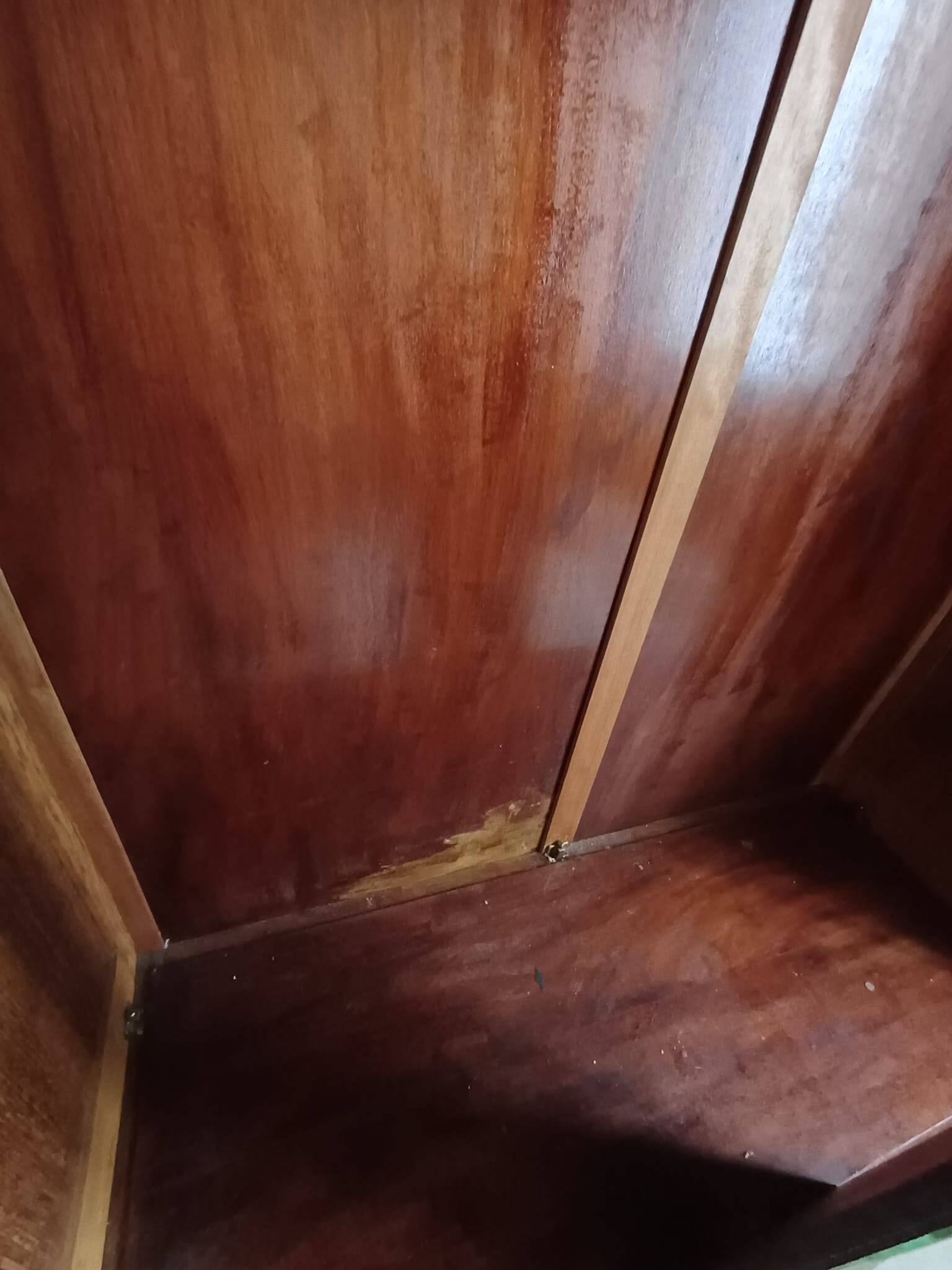 Vintage 1960s wooden wardrobe with a central mirror and tapered legs.