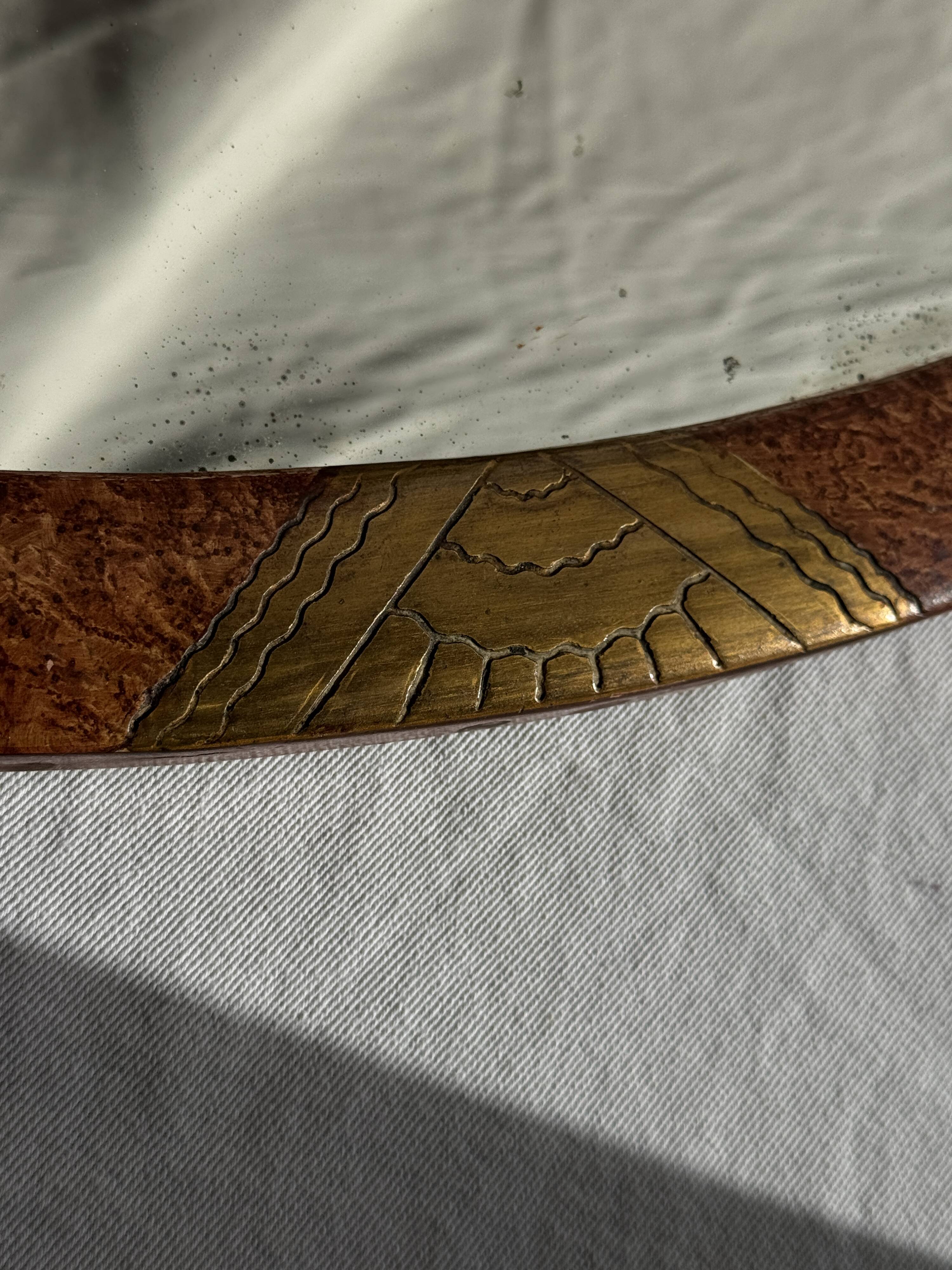 Small oval Art Deco mirror in brown and gold 33x54.