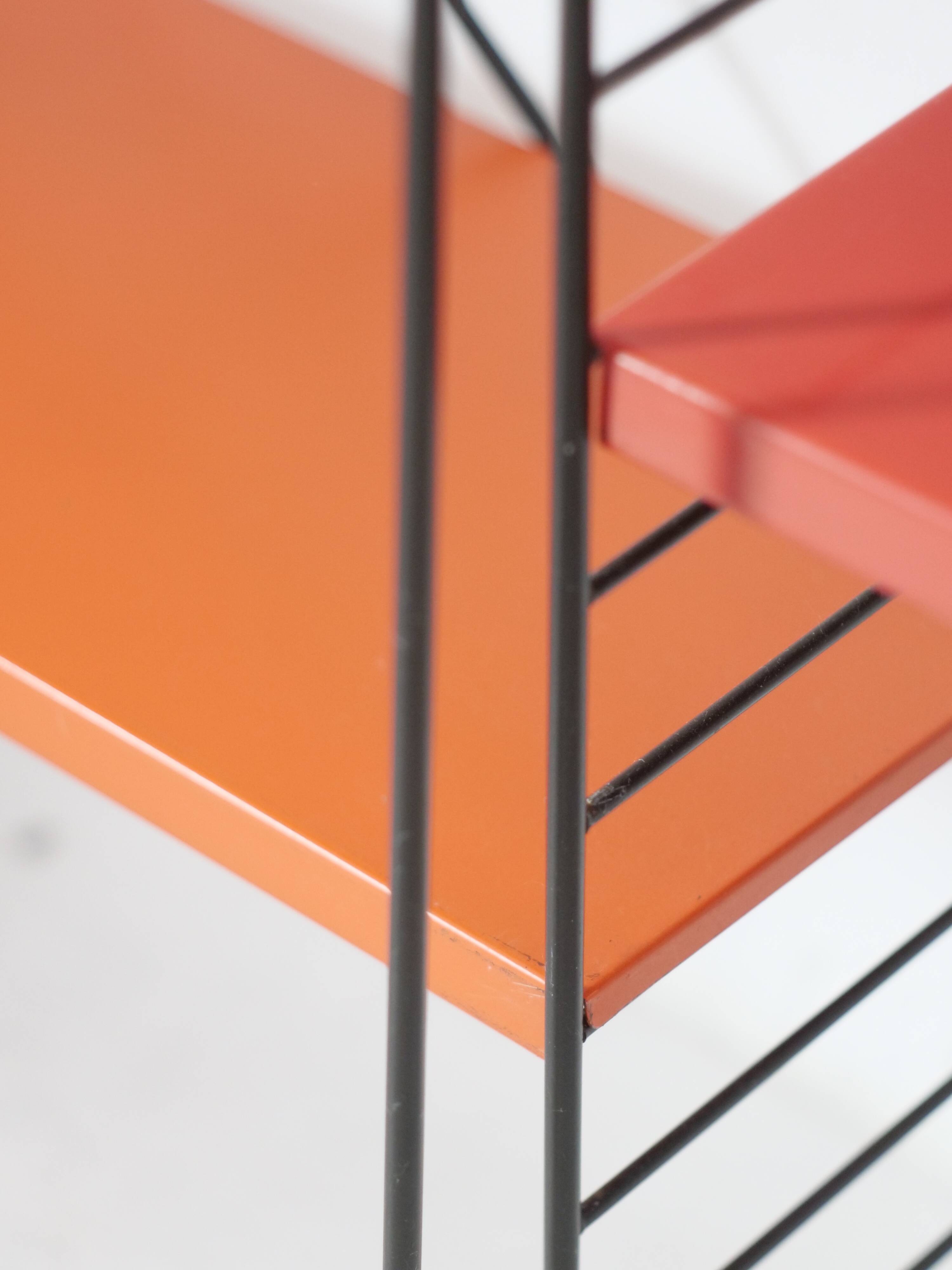 Tomado shelf in coloured metal floor shelves from 1958.