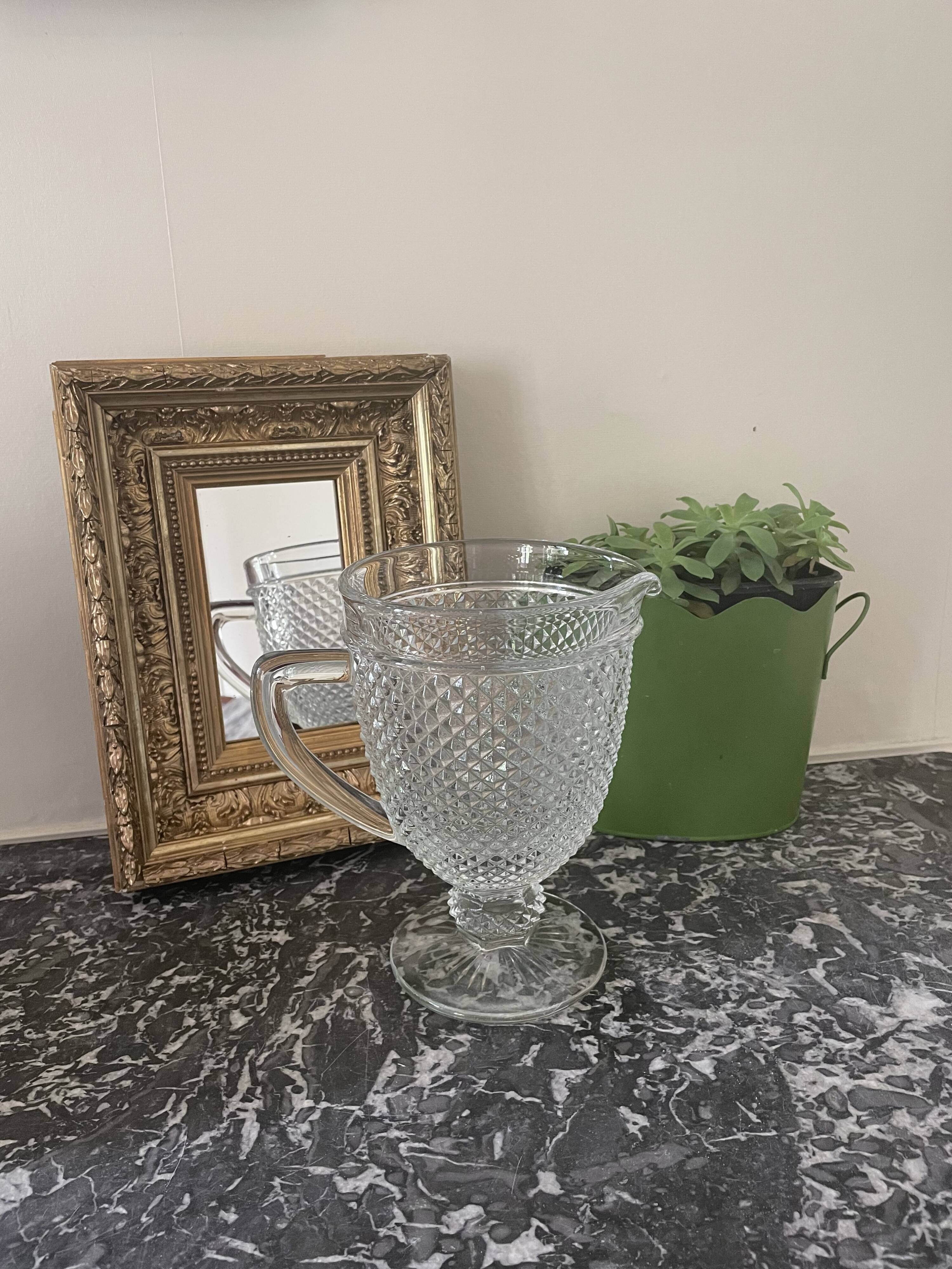 Pitcher on diamond point stand