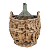 Demijohn in its wicker basket
