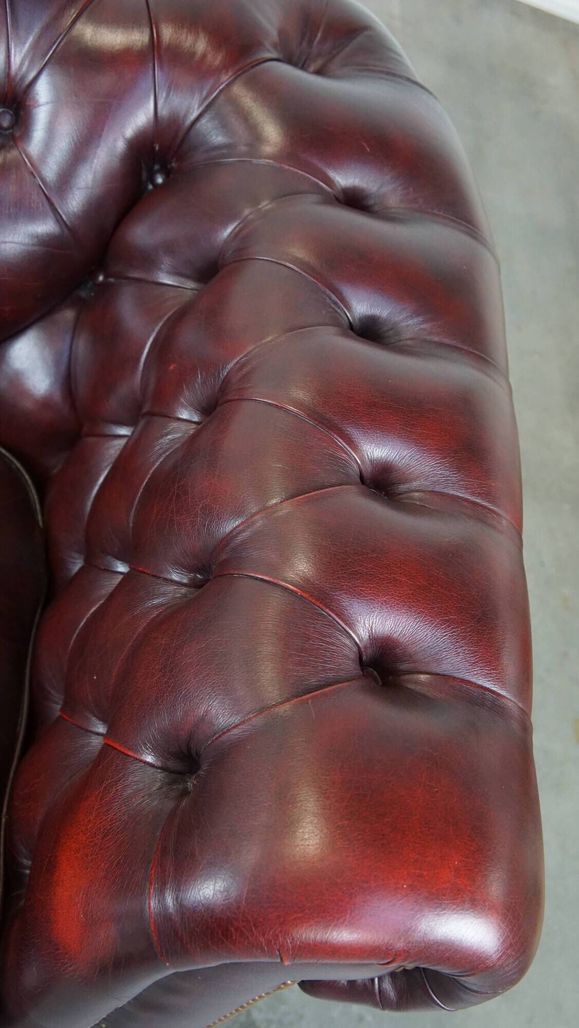 Original English Chesterfield sofa in red cowhide 2 seater