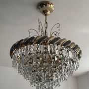Crystal and brass chandelier with a cascade of pendants.