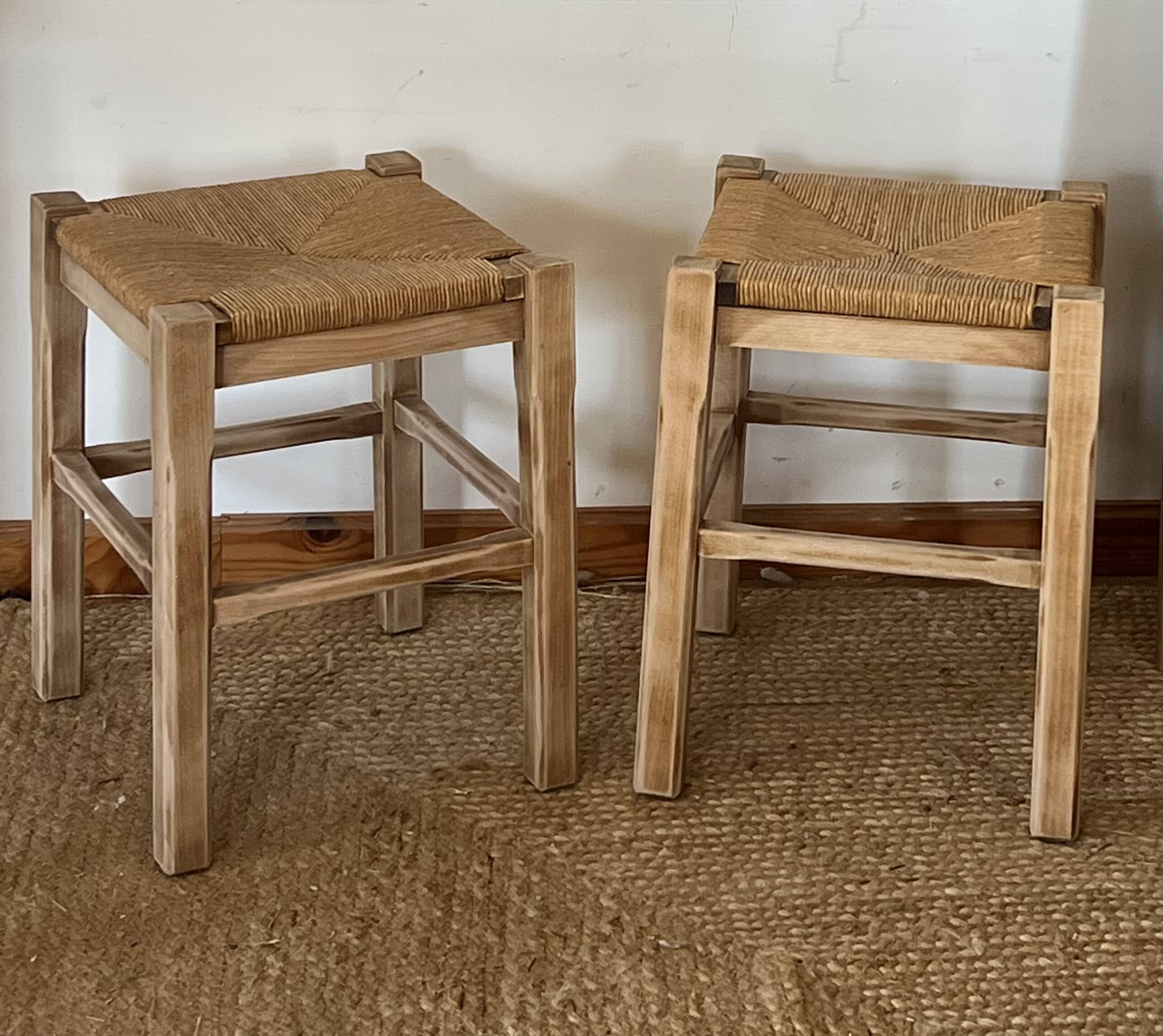 Pair of antique stools in raw solid wood with straw seats.