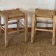 Pair of antique stools in raw solid wood with straw seats.