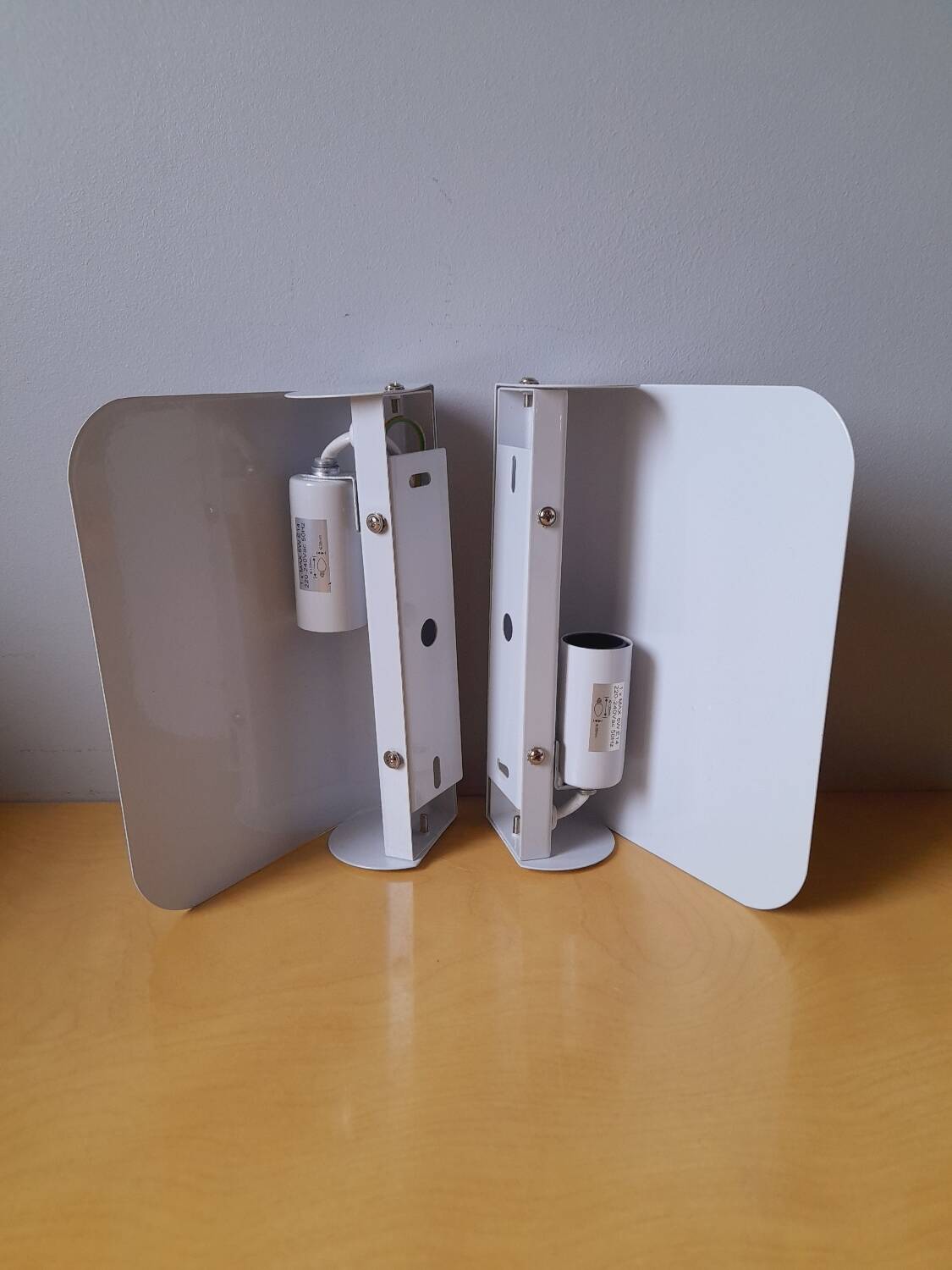 White lacquered metal wall sconces