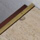 Minimalist console in travertine and patinated metal — 1970s