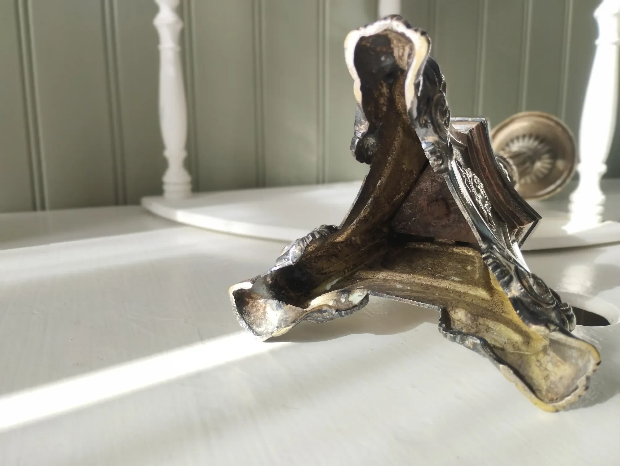 Old church candlestick in silver-plated metal