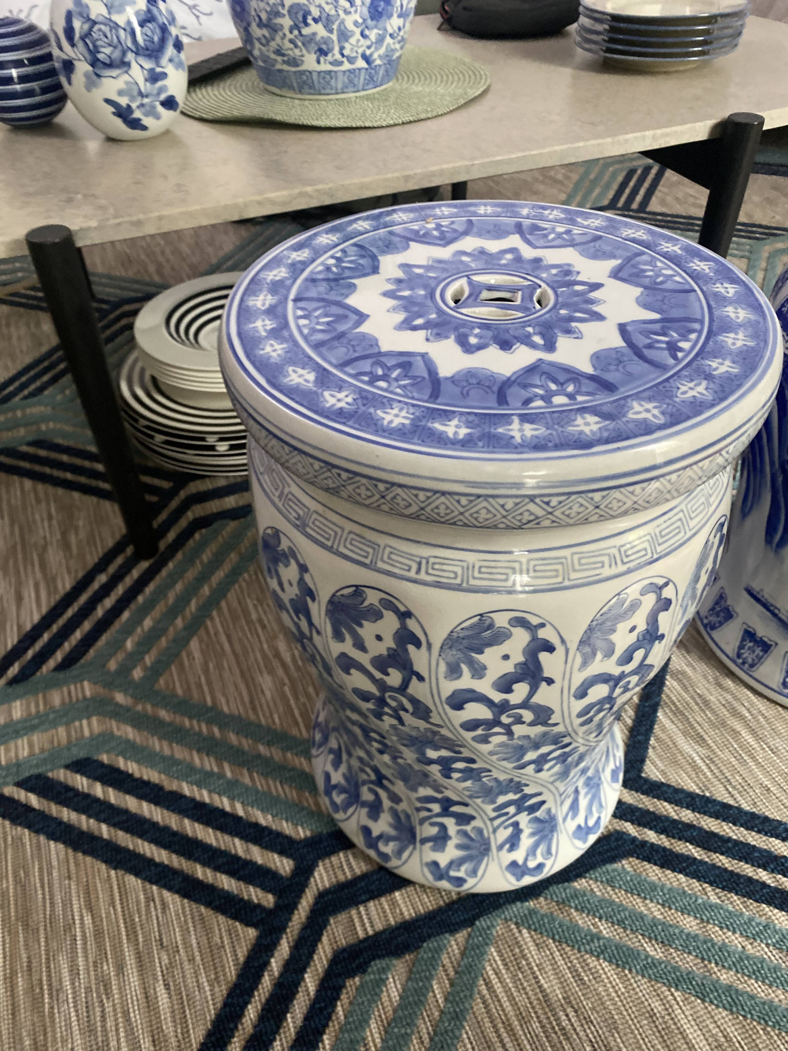 Set of two white and blue porcelain side tables.