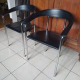 Pair of black and chrome leather Italian armchairs