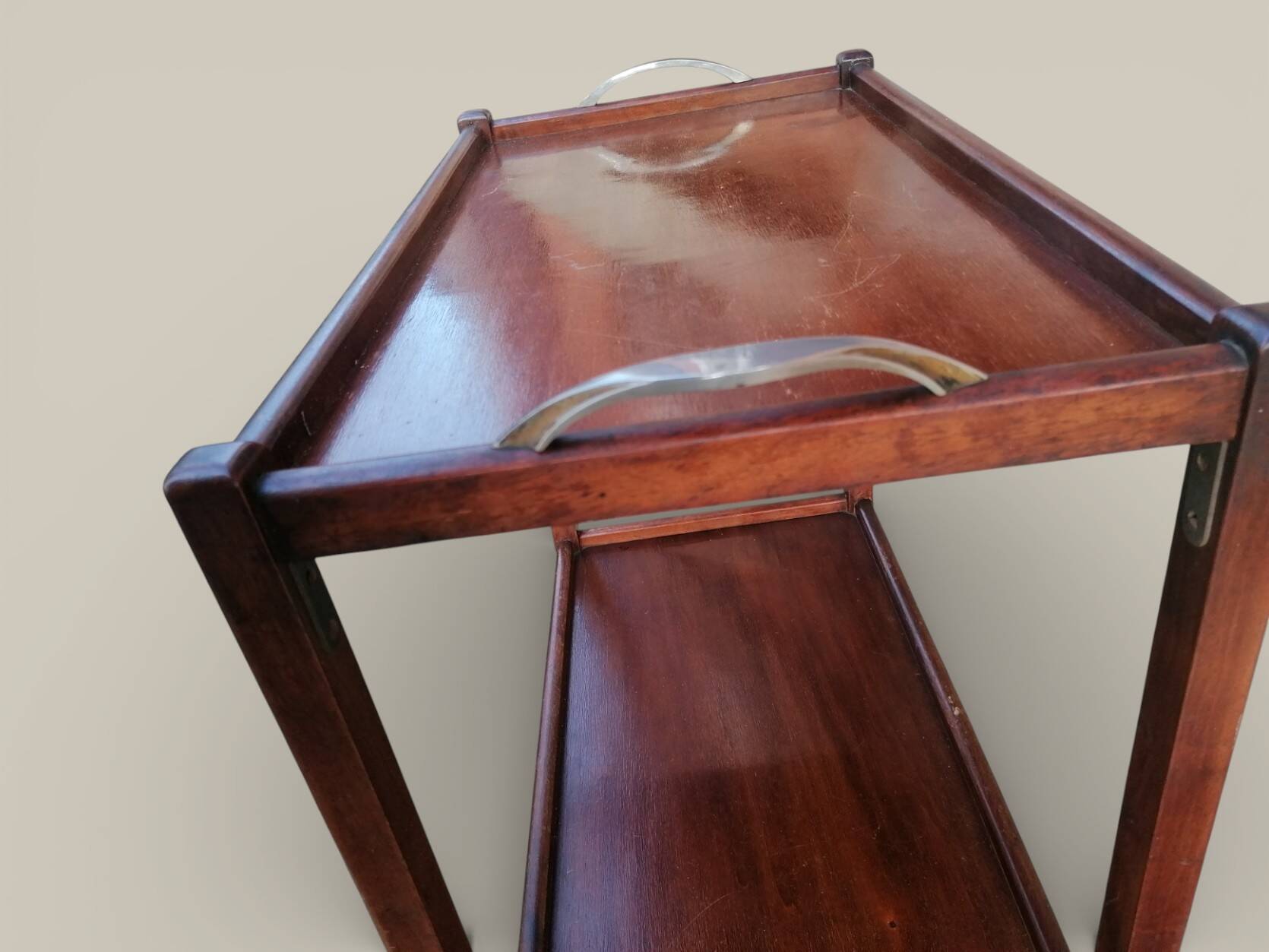 Art Deco wooden serving trolley on wheels.