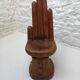 Sculpted wooden chair in the shape of a hand, 1960.