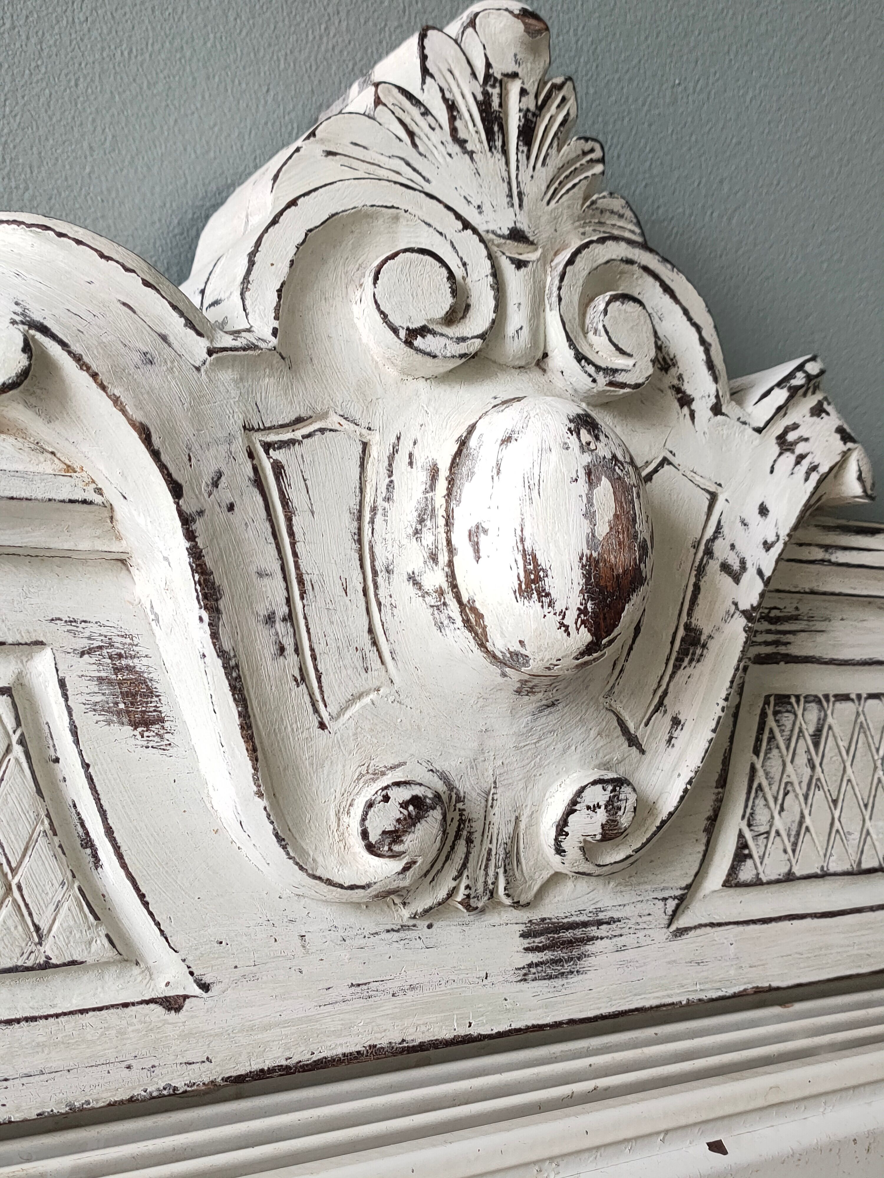 Old pediment in painted wood