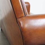 Very beautiful complete set consisting of a sheepskin leather sofa and two armchairs in cognac color