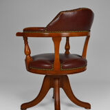 Swivel Chesterfield armchair in wood and leather