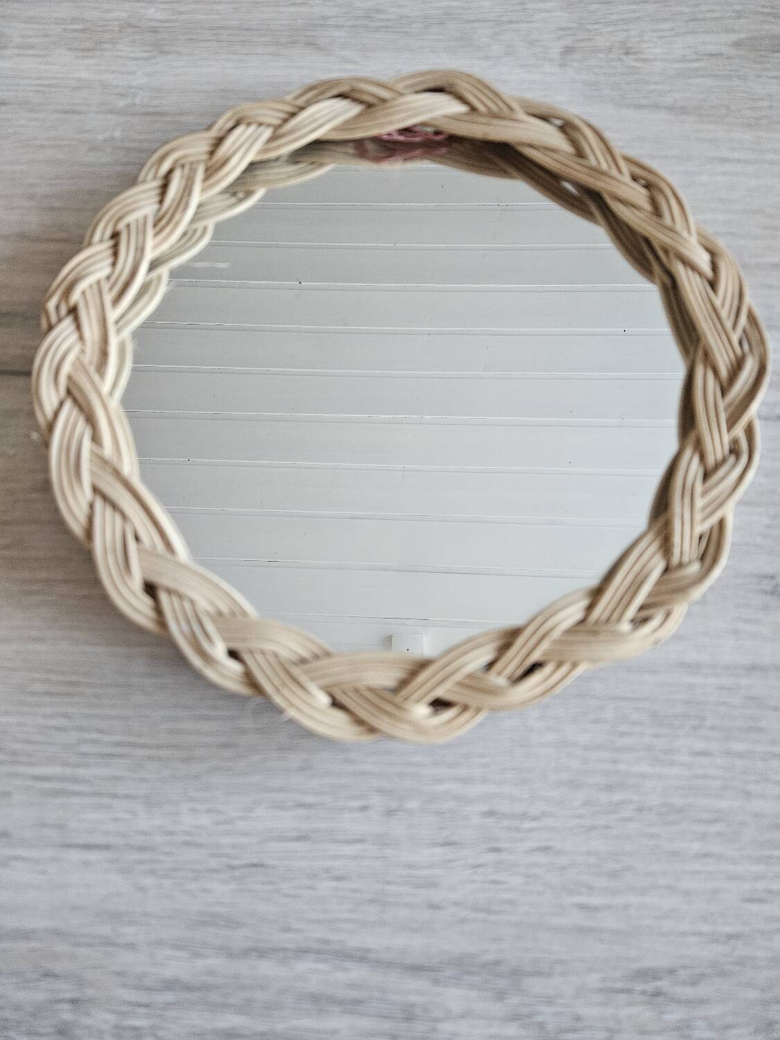Old small round wicker mirror