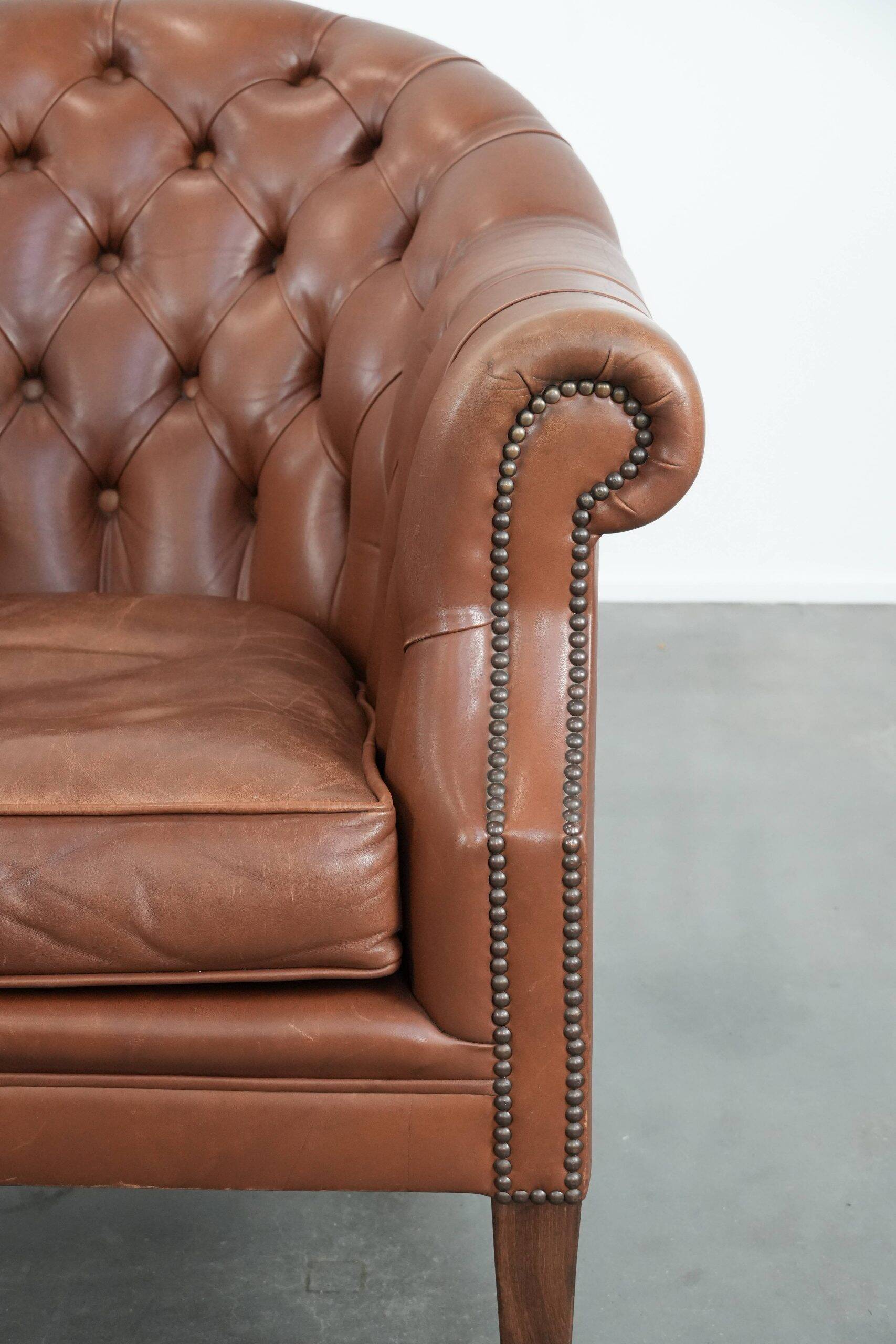 Chesterfield club armchair made of cowhide leather in English style