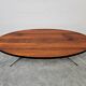 Danish Mid Century Modern oval coffee table with a teak top and chrome legs.