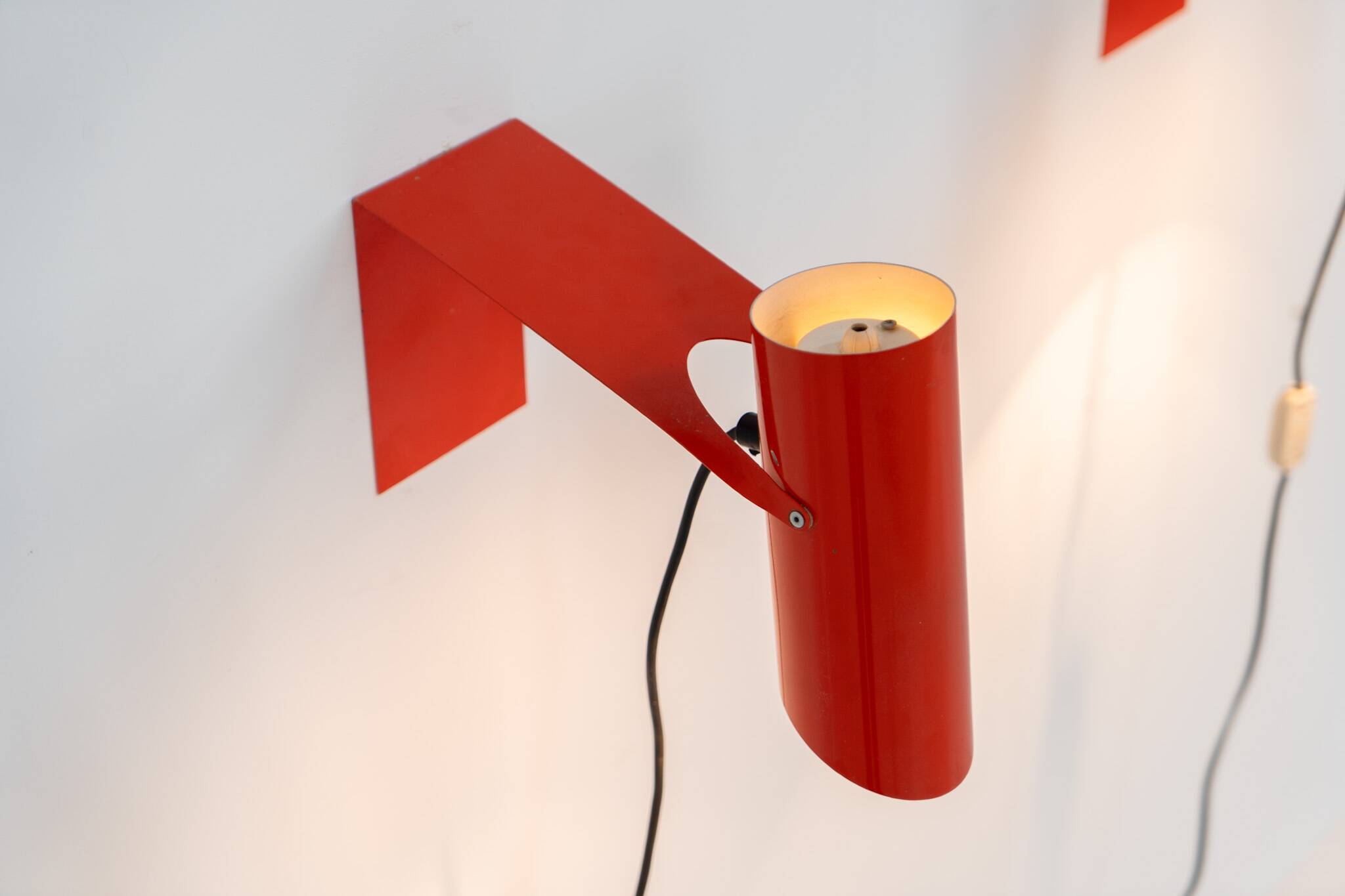 Pair of red metal wall lights