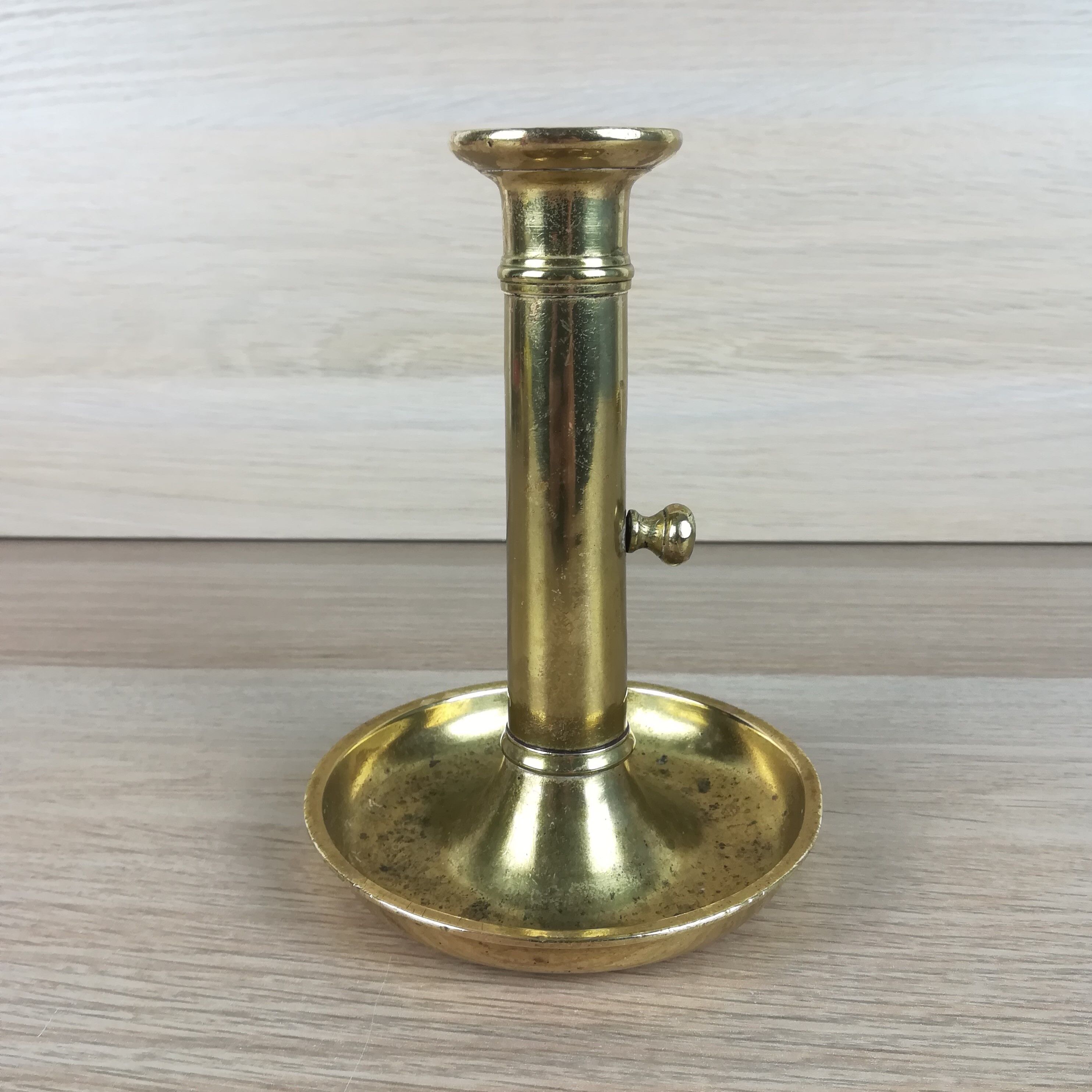 Brass pusher candle holder