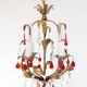Small Italian chandelier in gilded metal with leaves and red drops, c. 1960.