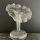 Vintage transparent glass vase in flower shape.