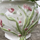 White ceramic pot cache in old flower slip