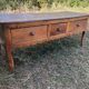 Antique Louis XV paneled table with 3 front drawers in solid cherry wood
