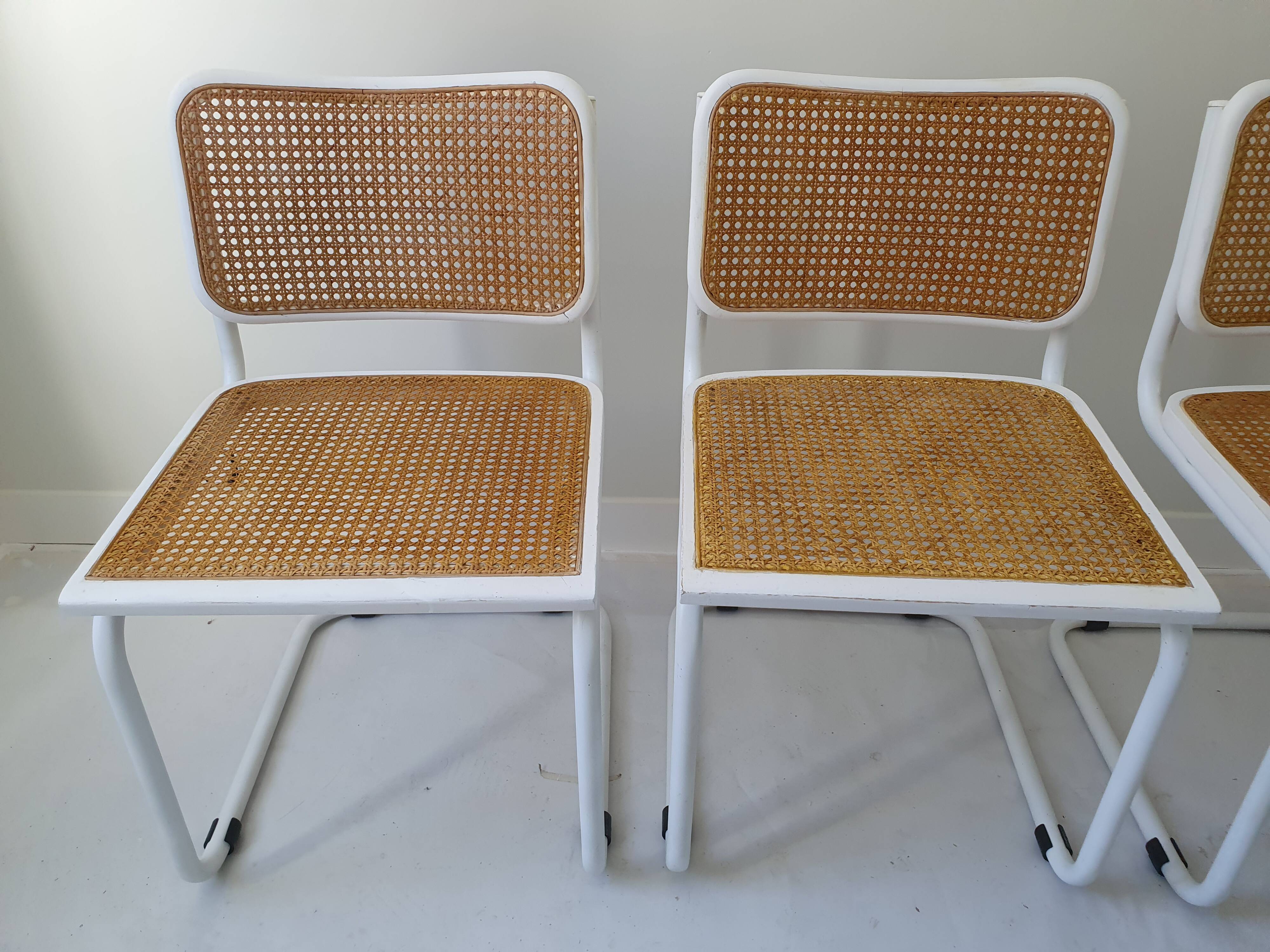 B32 chairs by Marcel Breuer in white.