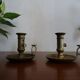 Pair of vintage brass pusher candle holders