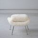 Womb Chair and Ottoman in fluffy white fabric by Eero Saarinen